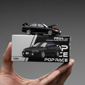 POPRACE 1:64 MITSUBISHI LANCER EVOLUTION IV – PYRENEES BLACK PEARL