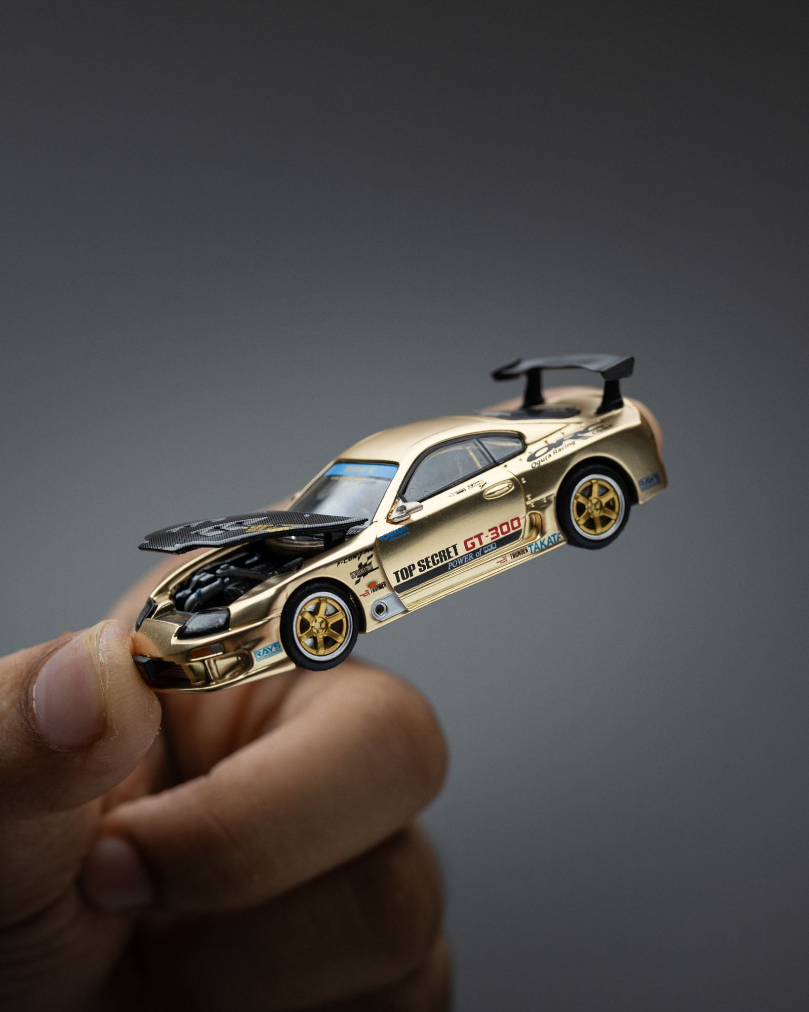 POP RACE 1:64 TOP SECRET GT300 SUPRA CHROME GOLD / CARBON HOOD