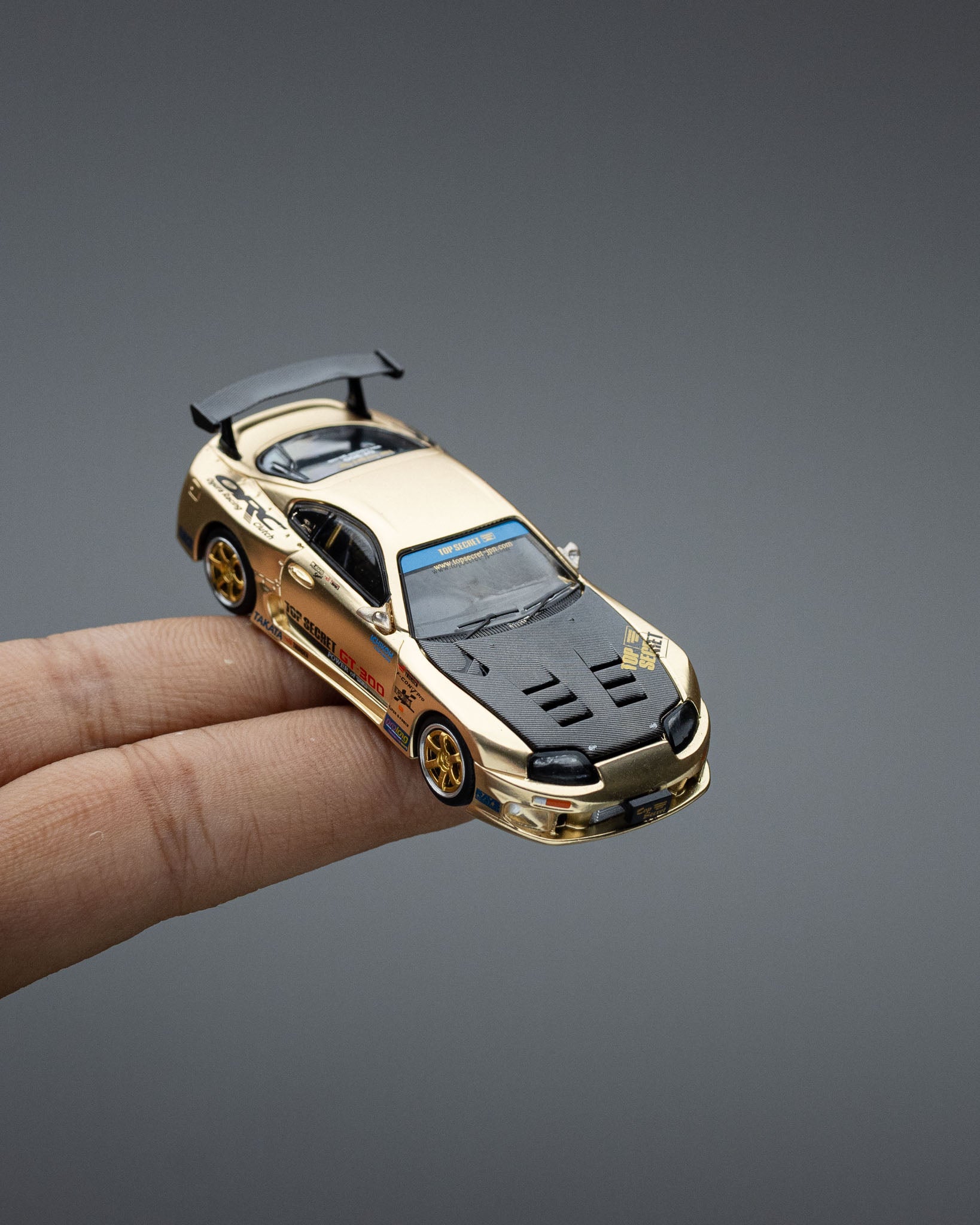 POP RACE 1:64 TOP SECRET GT300 SUPRA CHROME GOLD / CARBON HOOD