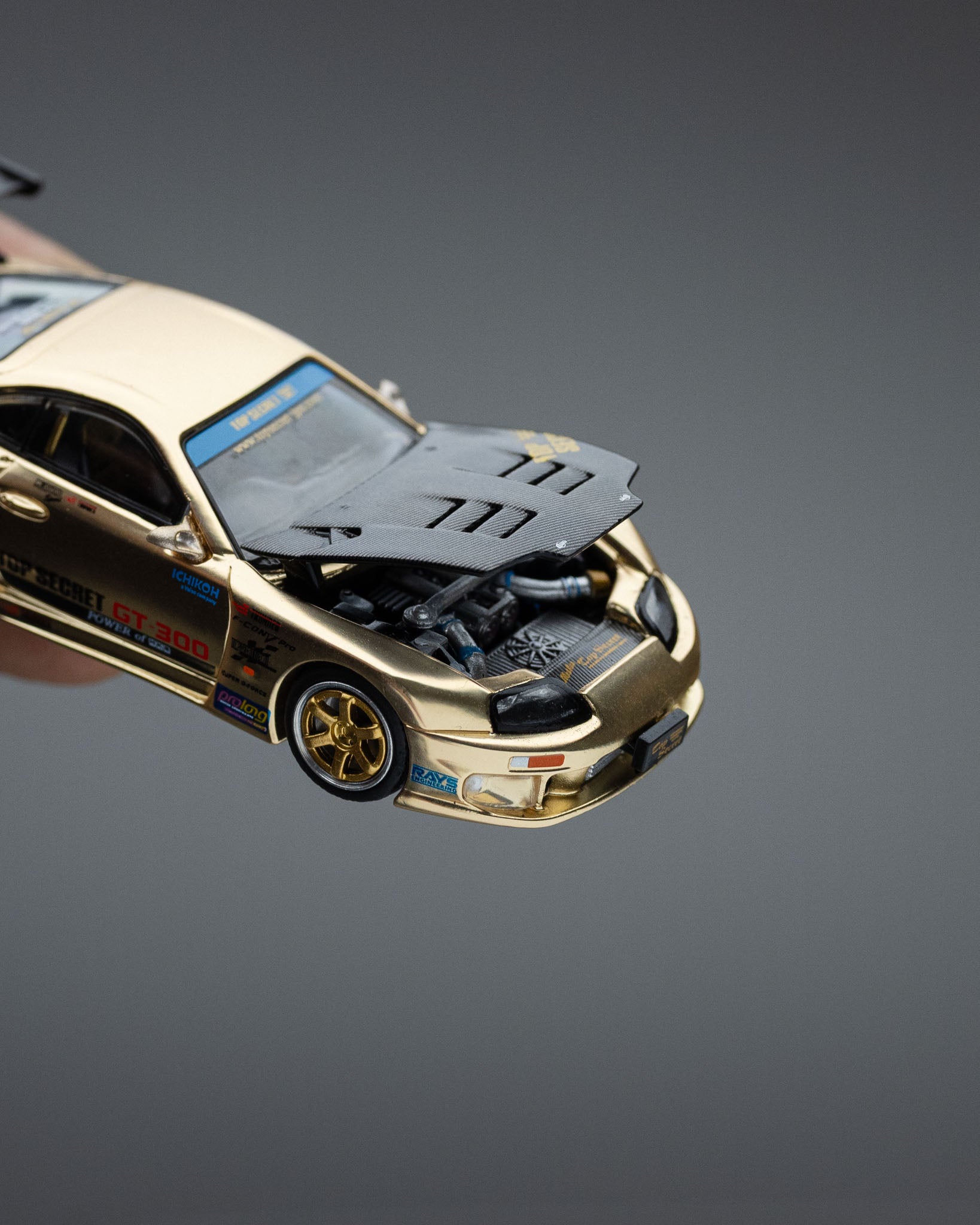 POP RACE 1:64 TOP SECRET GT300 SUPRA CHROME GOLD / CARBON HOOD